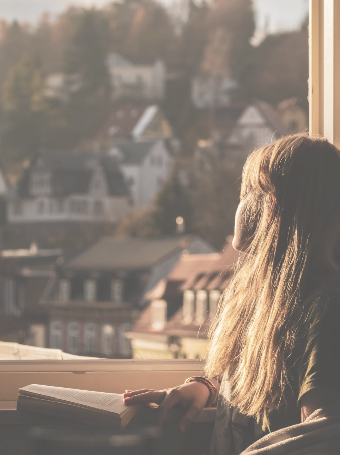 Woman looking out the window